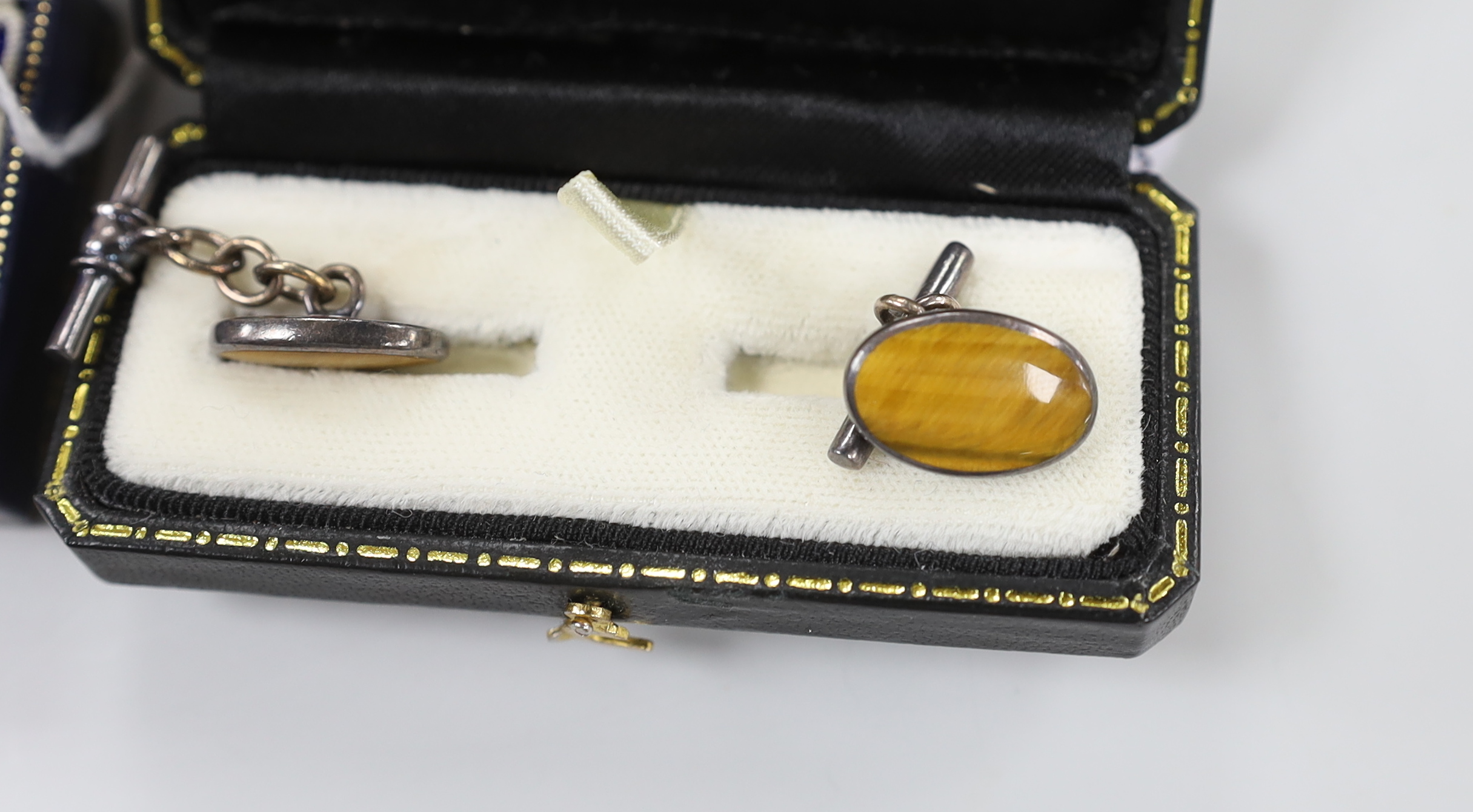 Four pairs of modern cufflinks including 925 and blue guilloche enamel and 925 and carnelian and two other white metal, set with tiger's eye quartz or mother of pearl.